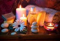 image of candels with masssage stones and oils
