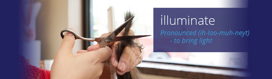 Brunette having her hair cut by a stlyist at illuminate Salon.